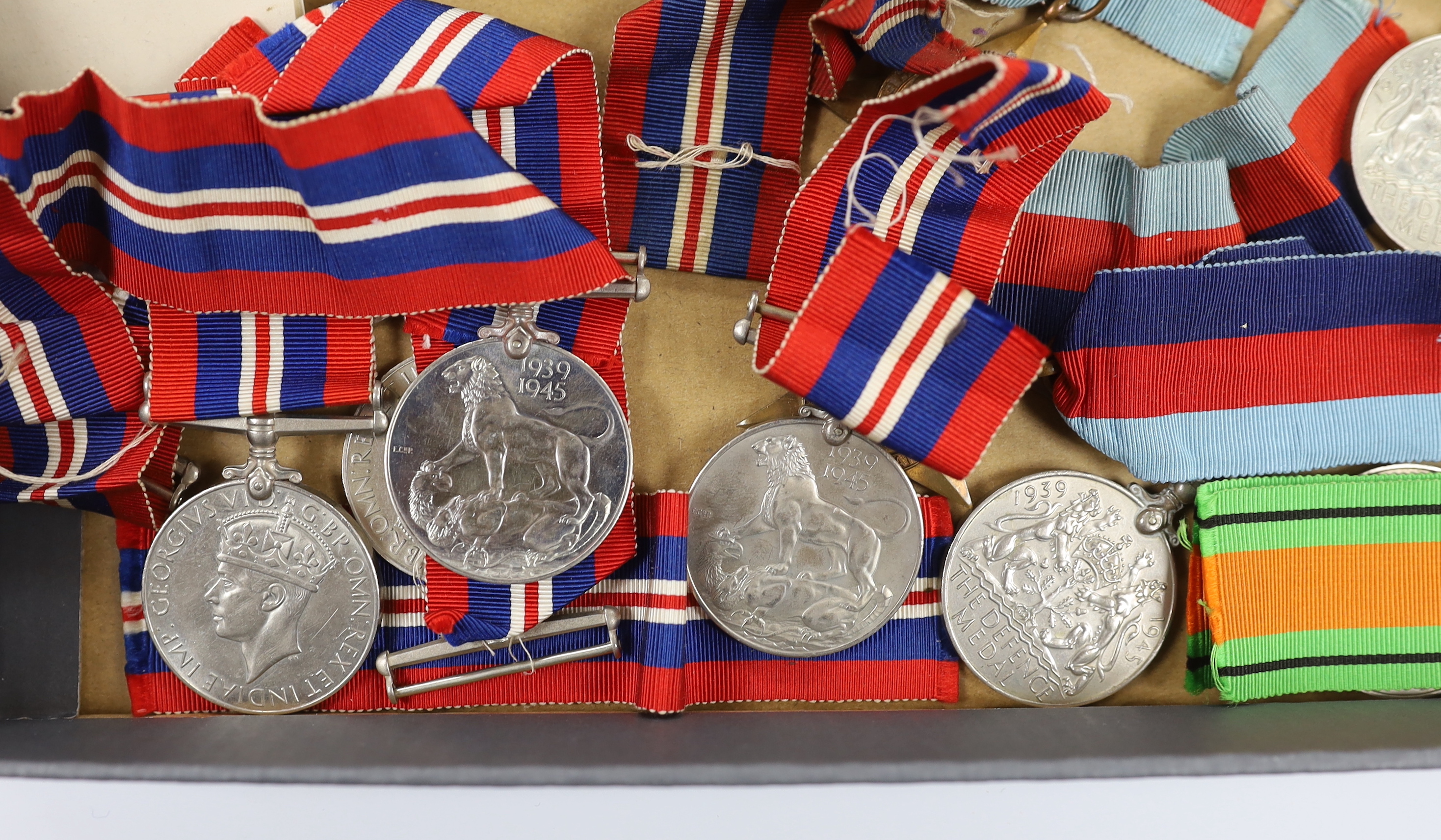 Fifteen WWII medals including some with original card boxes, including; eight War medals, three Defence medals and four 1939-1945 Stars